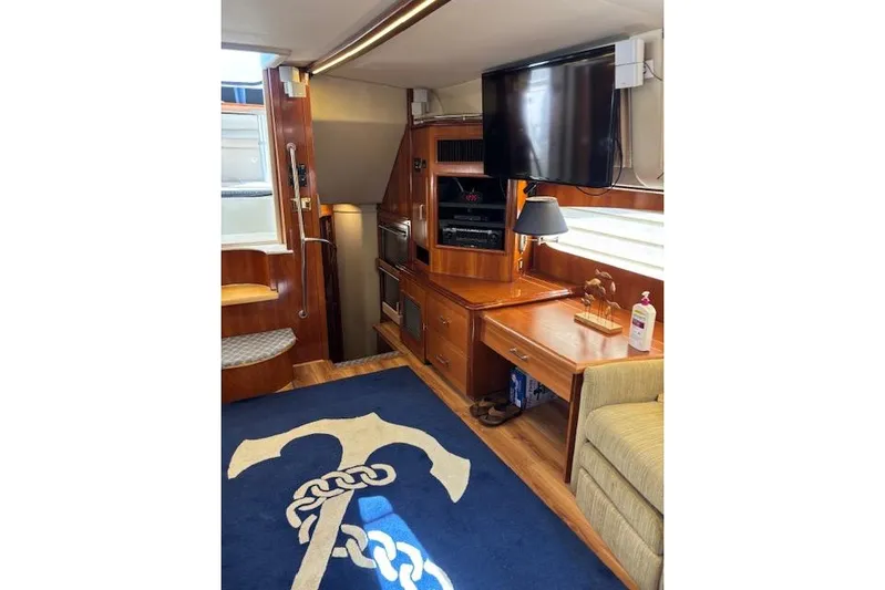  Yacht Photos Pics Luxurious interior of 2004 Carver 466 Motor Yacht with TV and nautical decor.
