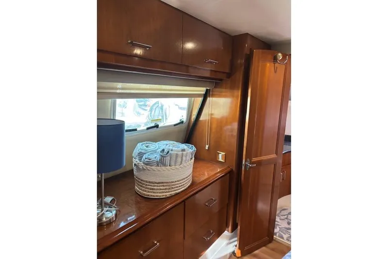  Yacht Photos Pics Interior of 2004 Carver 466 Motor Yacht with wooden cabinets and window.