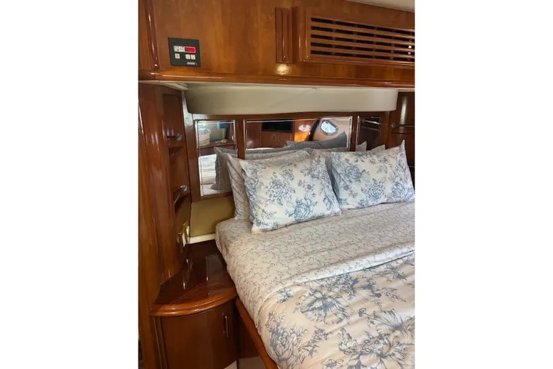  Yacht Photos Pics Luxurious bedroom interior of 2004 Carver 466 Motor Yacht with floral bedding.