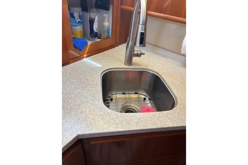  Yacht Photos Pics Sink area in 2004 Carver 466 Motor Yacht with modern faucet and countertop.