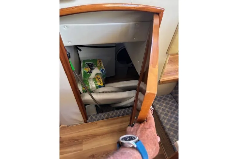  Yacht Photos Pics Storage compartment in 2004 Carver 466 Motor Yacht with cleaning supplies and equipment.