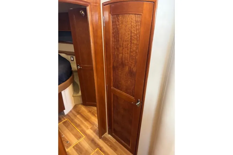  Yacht Photos Pics Interior of 2004 Carver 466 Motor Yacht with wooden doors and flooring.