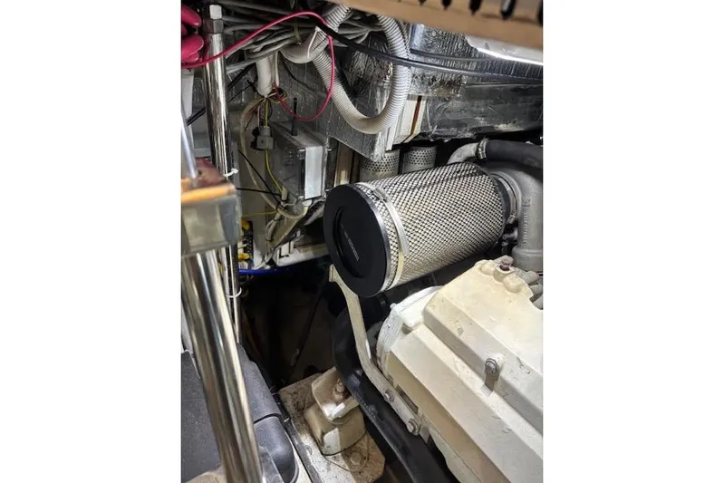  Yacht Photos Pics Engine room of 2004 Carver 466 Motor Yacht, showcasing mechanical components and wiring.