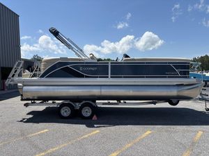2025 Godfrey SWEETWATER 2286 SB pontoon boat on trailer, parked outdoors.