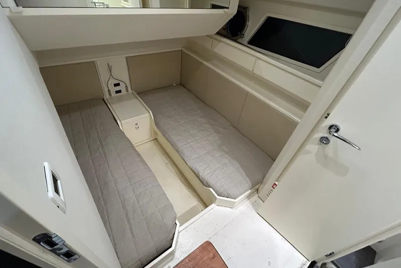  Yacht Photos Pics Interior cabin of 2013 Itama 62 yacht with twin beds and modern design.