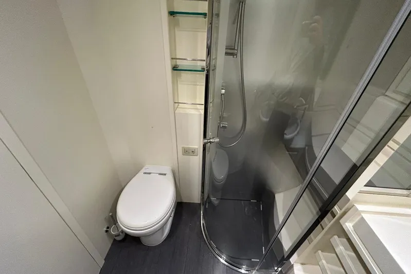  Yacht Photos Pics Bathroom interior of 2013 Itama 62 yacht with shower and toilet.