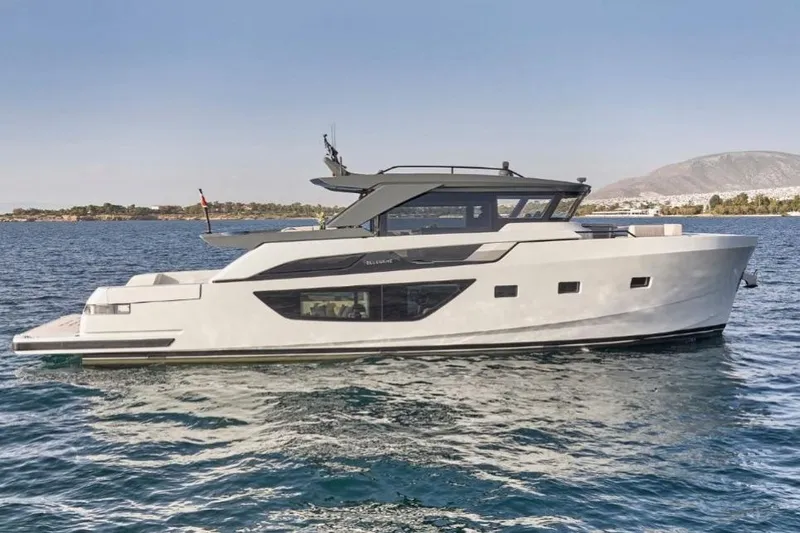  Yacht Photos Pics 2024 Bluegame BGX63 yacht cruising on open water, showcasing sleek design and modern features.