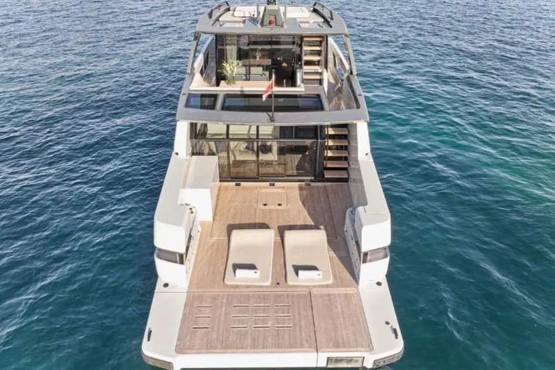  Yacht Photos Pics 2024 Bluegame BGX63 yacht with spacious deck, modern design, and luxurious amenities on open water.