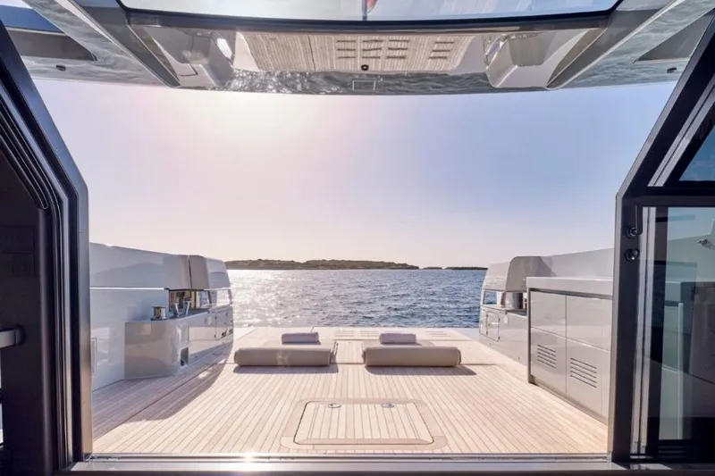  Yacht Photos Pics 2024 Bluegame BGX63 yacht deck with ocean view and sun loungers.
