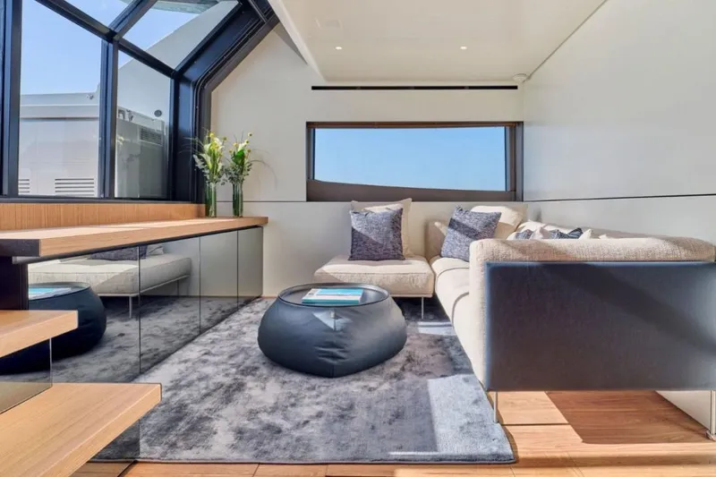  Yacht Photos Pics Luxurious interior of 2024 Bluegame BGX63 yacht with modern seating and large windows.