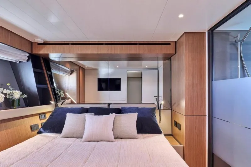 Yacht Photos Pics Luxurious interior of 2024 Bluegame BGX63 yacht bedroom with modern design elements.