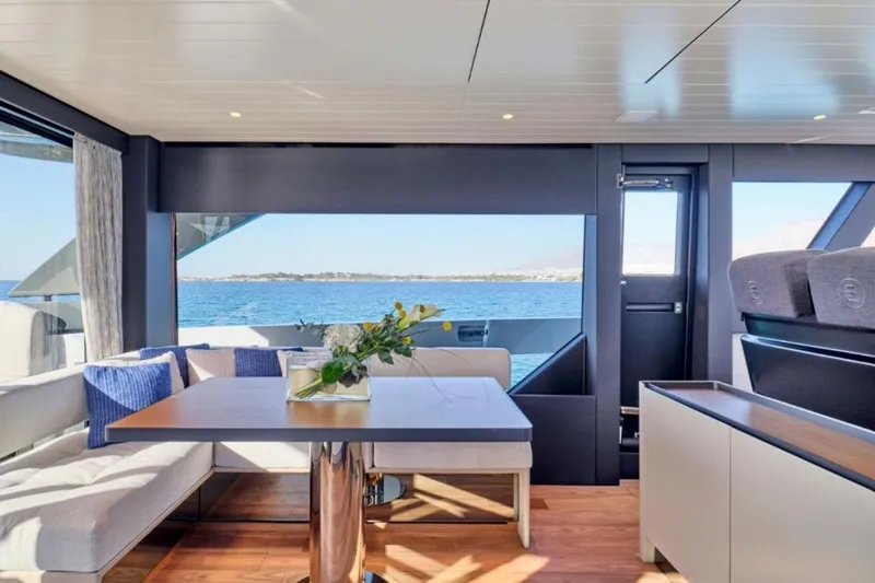  Yacht Photos Pics Luxurious interior of 2024 Bluegame BGX63 yacht with ocean view and elegant seating area.