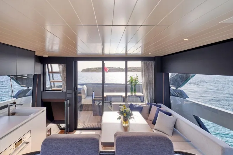  Yacht Photos Pics Luxurious interior of 2024 Bluegame BGX63 yacht with ocean view and elegant seating area.
