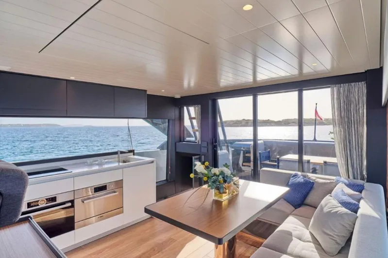  Yacht Photos Pics Luxurious interior of 2024 Bluegame BGX63 yacht with modern kitchen and ocean view.