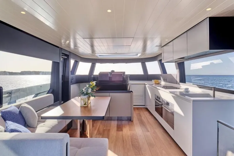  Yacht Photos Pics Luxurious interior of 2024 Bluegame BGX63 yacht with modern kitchen and ocean view.