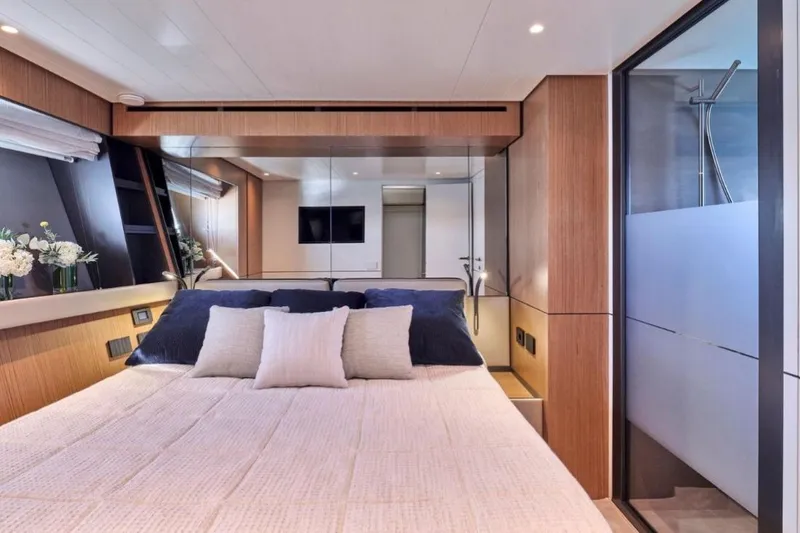  Yacht Photos Pics Luxurious bedroom interior of 2024 Bluegame BGX63 yacht with modern design and elegant decor.