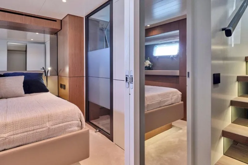  Yacht Photos Pics Luxurious interior of 2024 Bluegame BGX63 yacht with modern bedroom design.