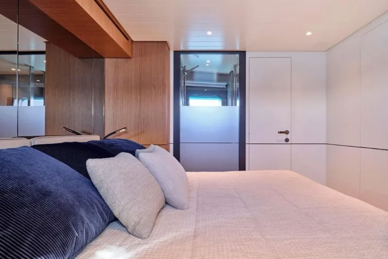  Yacht Photos Pics Luxurious interior of 2024 Bluegame BGX63 yacht bedroom with modern design.