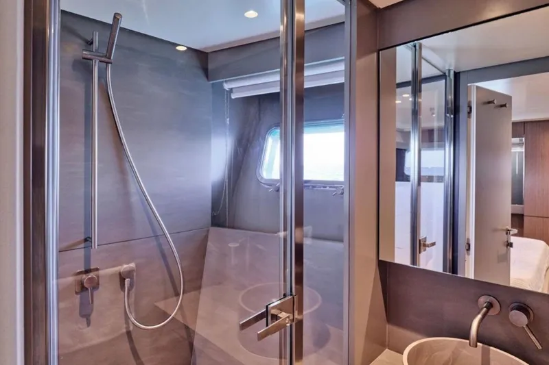  Yacht Photos Pics Luxurious bathroom interior of 2024 Bluegame BGX63 yacht with modern shower design.