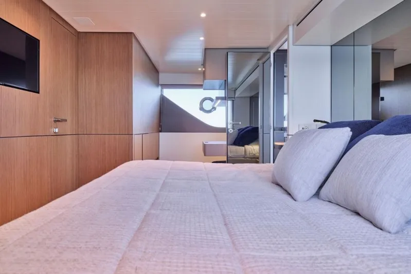  Yacht Photos Pics Luxurious interior of 2024 Bluegame BGX63 yacht with modern bedroom design.