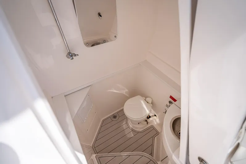  Yacht Photos Pics 2017 Intrepid 400 Center Console boat bathroom interior with toilet and shower.