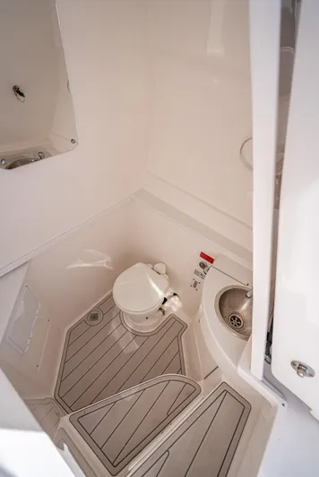  Yacht Photos Pics 2017 Intrepid 400 Center Console boat interior with compact bathroom amenities.