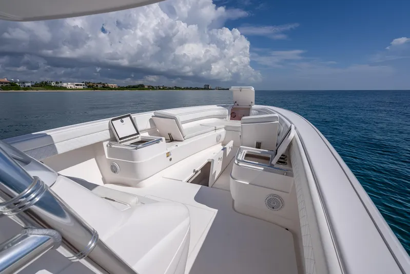  Yacht Photos Pics 2017 Intrepid 400 Center Console boat on calm ocean waters under cloudy sky.