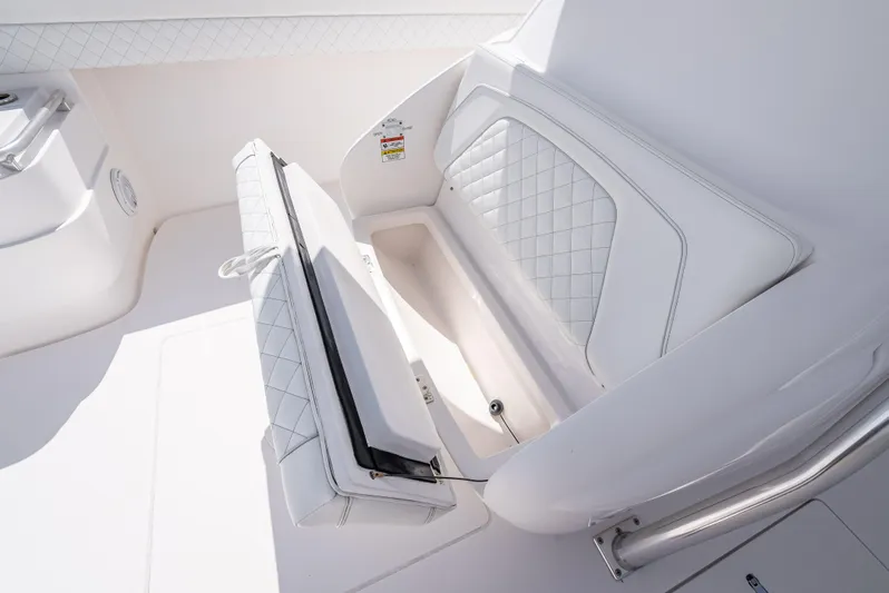  Yacht Photos Pics 2017 Intrepid 400 Center Console boat seat with storage compartment.
