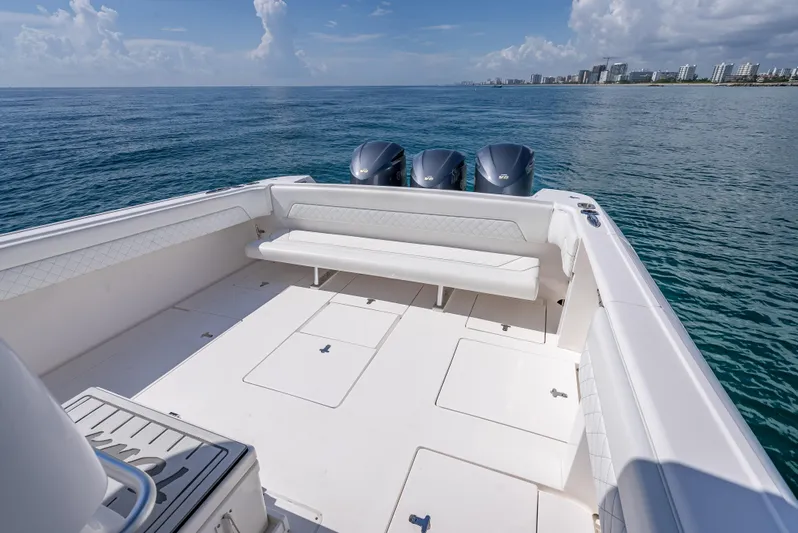  Yacht Photos Pics 2017 Intrepid 400 Center Console boat with triple engines on open water.