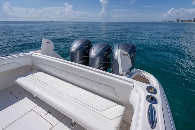  Yacht Photos Pics 2017 Intrepid 400 Center Console boat with triple outboard engines on open sea.