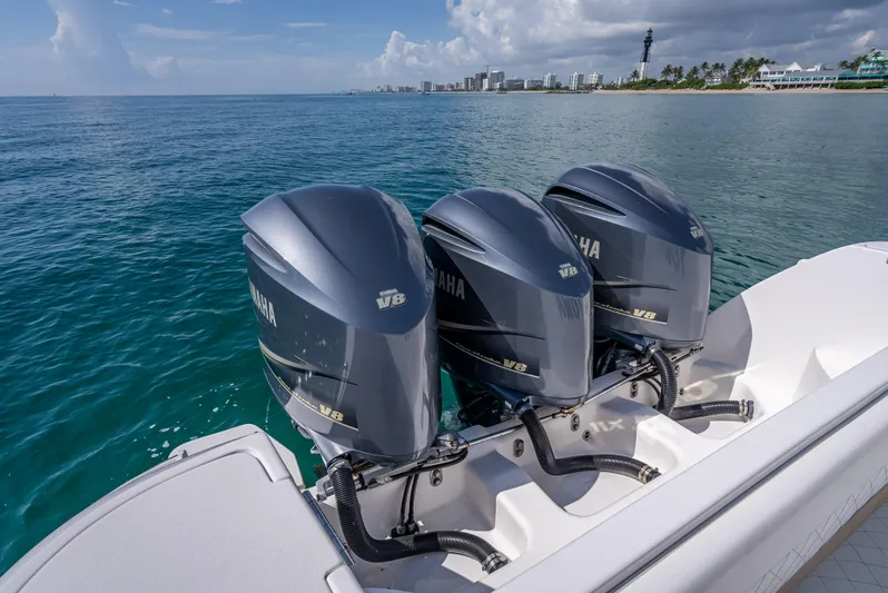  Yacht Photos Pics 2017 Intrepid 400 Center Console with triple Yamaha outboard engines on the ocean.