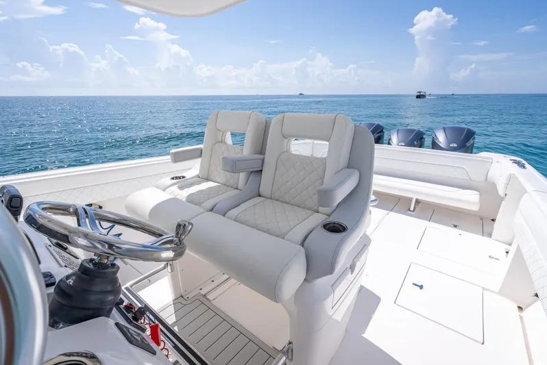  Yacht Photos Pics 2017 Intrepid 400 Center Console boat interior with ocean view and plush seating.