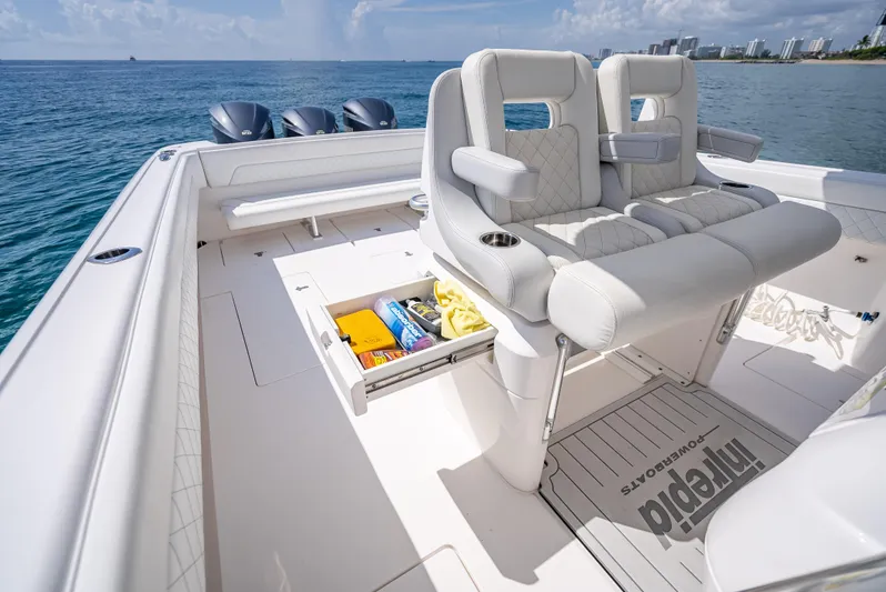  Yacht Photos Pics 2017 Intrepid 400 Center Console boat interior with seating and storage, ocean view.
