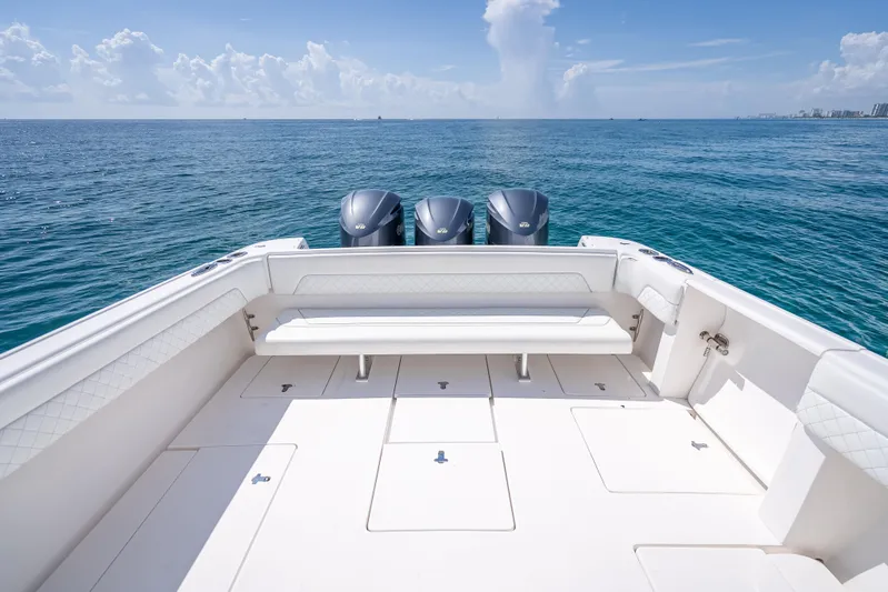  Yacht Photos Pics 2017 Intrepid 400 Center Console boat with triple engines on open sea.