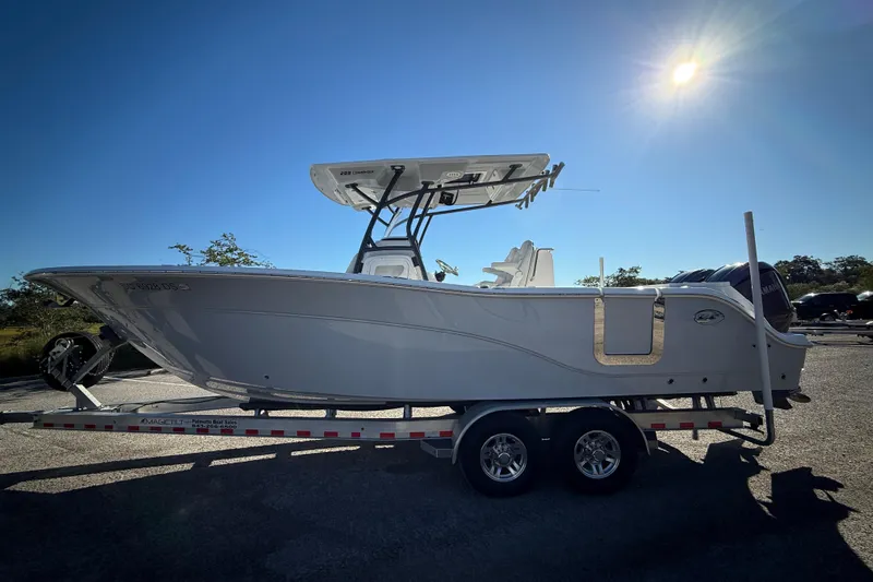 Lucky Penny Yacht Photos Pics 2022 Sea Fox 288 Commander boat on trailer under bright sun.