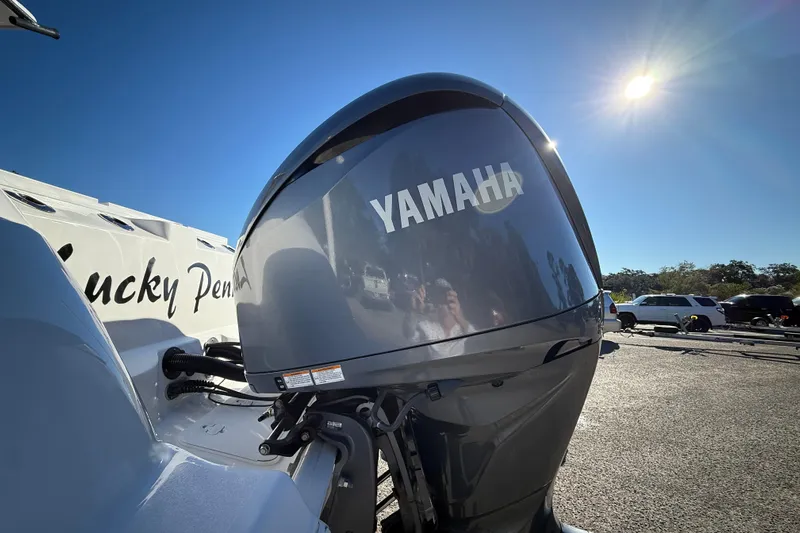 Lucky Penny Yacht Photos Pics Yamaha engine on 2022 Sea Fox 288 Commander boat under bright sun.