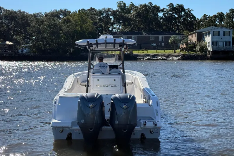 Lucky Penny Yacht Photos Pics 2022 Sea Fox 288 Commander boat on a sunny river, rear view.