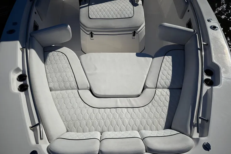 Lucky Penny Yacht Photos Pics 2022 Sea Fox 288 Commander boat interior with cushioned seating and storage.