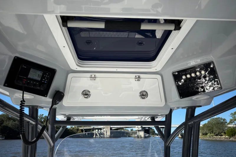 Lucky Penny Yacht Photos Pics Interior view of 2022 Sea Fox 288 Commander boat console with electronics and storage.