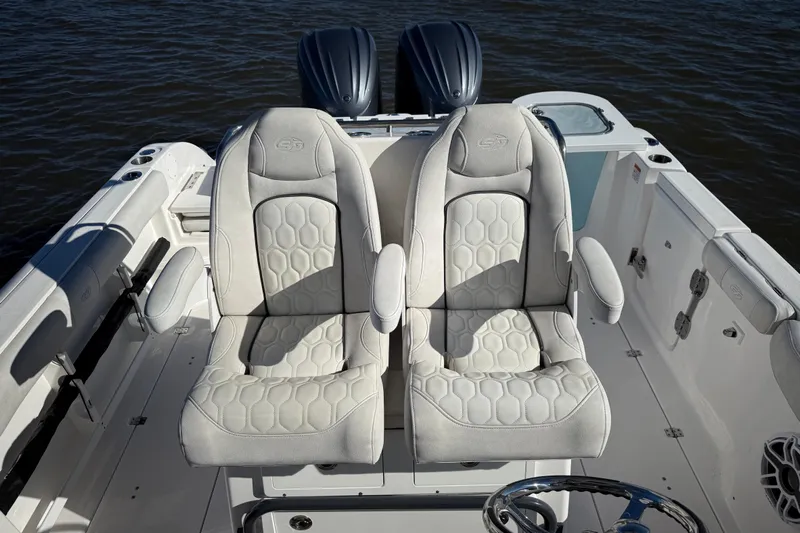 Lucky Penny Yacht Photos Pics 2022 Sea Fox 288 Commander boat with luxurious dual captain's chairs on deck.