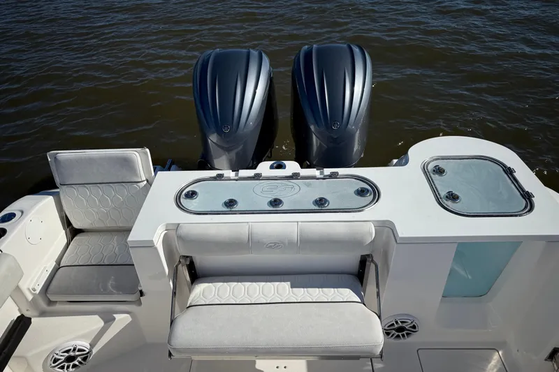 Lucky Penny Yacht Photos Pics 2022 Sea Fox 288 Commander boat with dual engines and seating, on water.