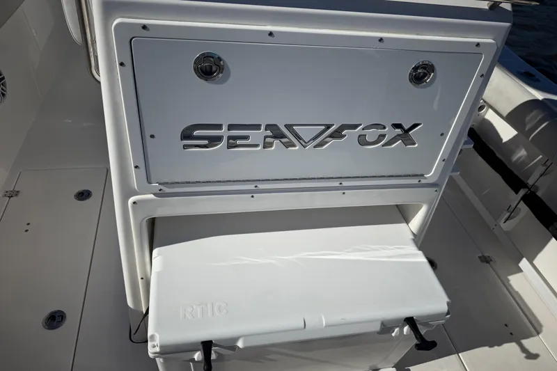 Lucky Penny Yacht Photos Pics 2022 Sea Fox 288 Commander boat interior with branded storage compartment.