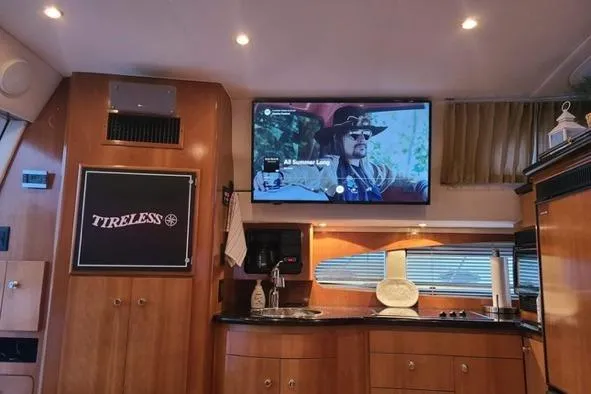  Yacht Photos Pics Interior of 2002 Carver 410 Sport Sedan with TV and kitchenette.