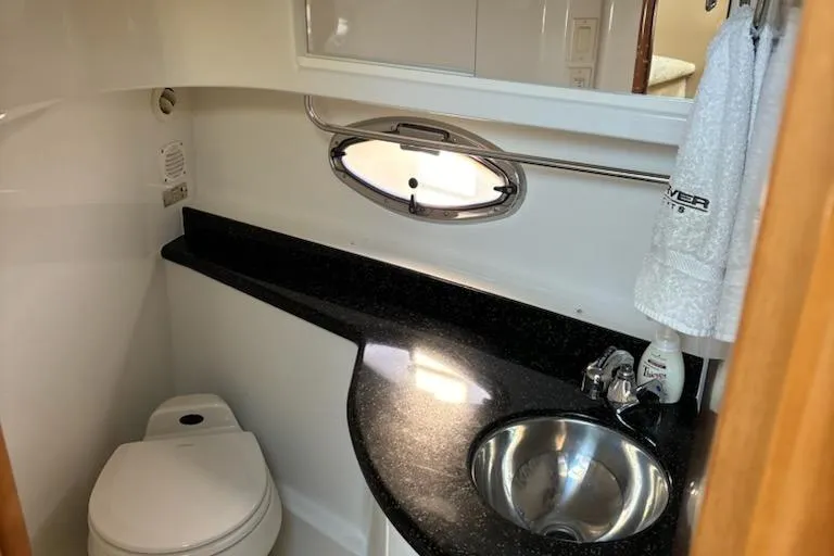  Yacht Photos Pics Luxurious bathroom in 2002 Carver 410 Sport Sedan yacht with sleek design.