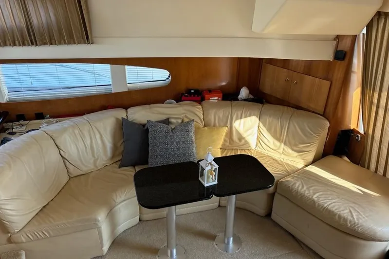  Yacht Photos Pics Luxurious interior of 2002 Carver 410 Sport Sedan with leather seating and elegant decor.