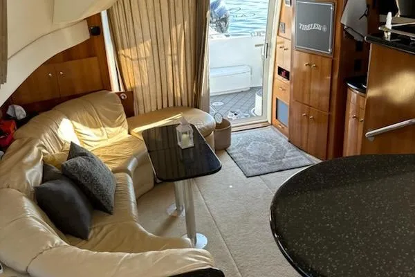  Yacht Photos Pics Luxurious interior of a 2002 Carver 410 Sport Sedan yacht with plush seating and elegant decor.