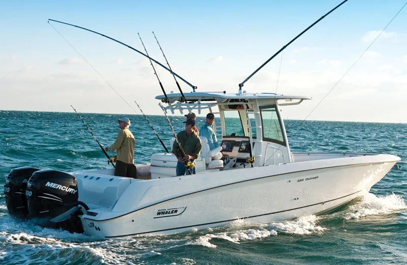  Yacht Photos Pics 2015 Boston Whaler 320 Outrage boat with anglers fishing in open water.