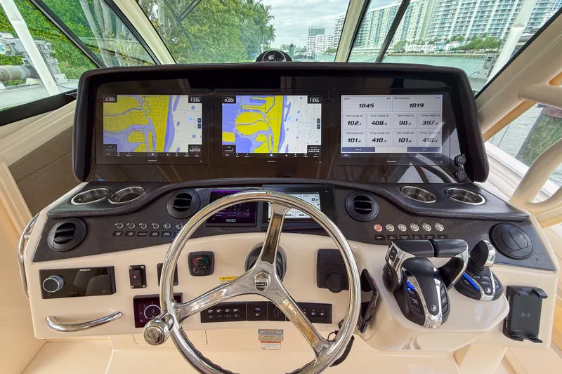  Yacht Photos Pics 2022 Grady-White Canyon 456 helm with advanced navigation displays and controls.