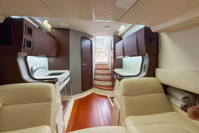  Yacht Photos Pics Luxurious interior of 2022 Grady-White Canyon 456 boat with modern kitchen and seating.