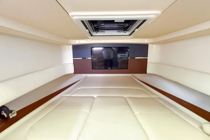  Yacht Photos Pics Luxurious interior cabin of 2022 Grady-White Canyon 456 with TV and plush seating.